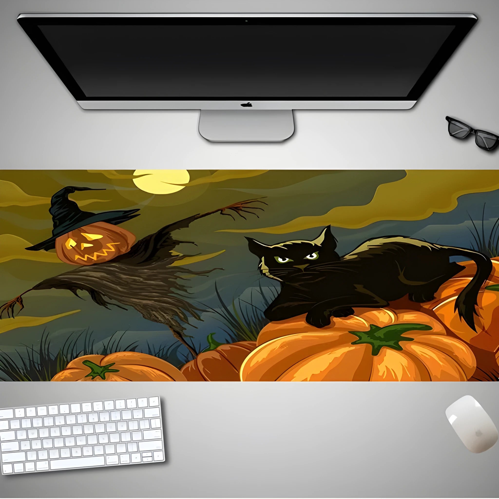 Oversized Halloween-themed rubber cloth mouse pad on a desk, showing non-slip base and large surface area.