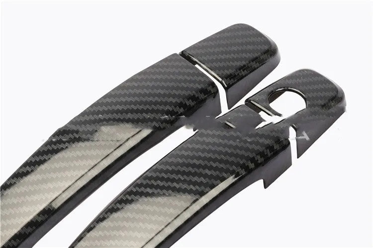 Carbon fibre pattern door handle cover for Opel Vauxhall Astra H and J car interior.