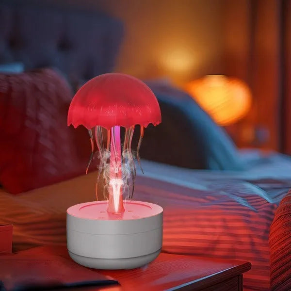 White jellyfish-shaped humidifier and essential oil diffuser with colourful LED night light on desktop