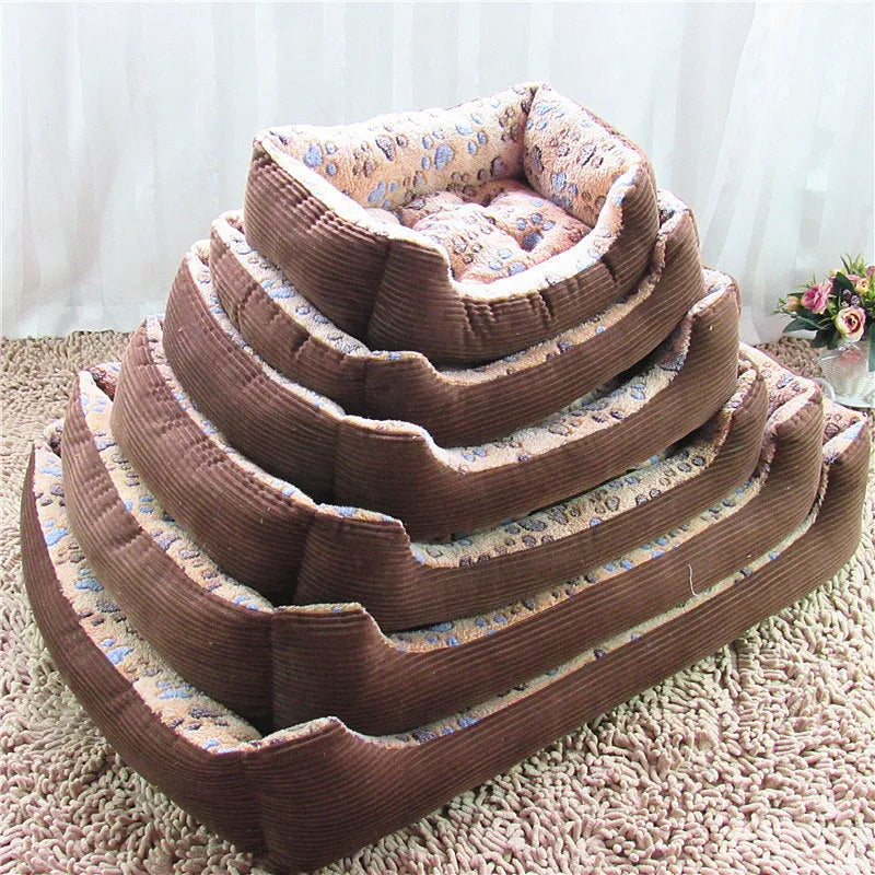 Beige plush dog bed with removable cover on a wooden floor, shown next to a small dog.