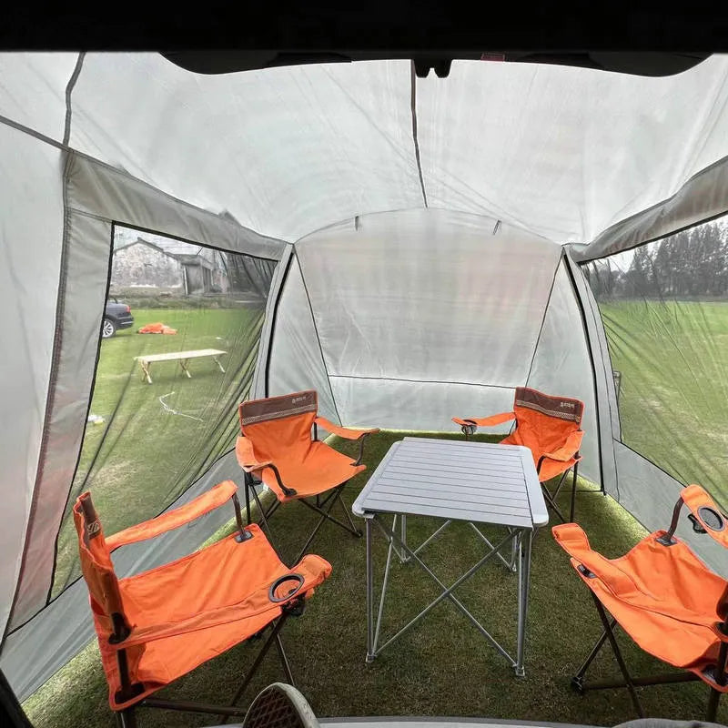 Car tail extension tent set up at a campsite with rear access, showing 190T silver-coated anti-UV fabric and screen windows.