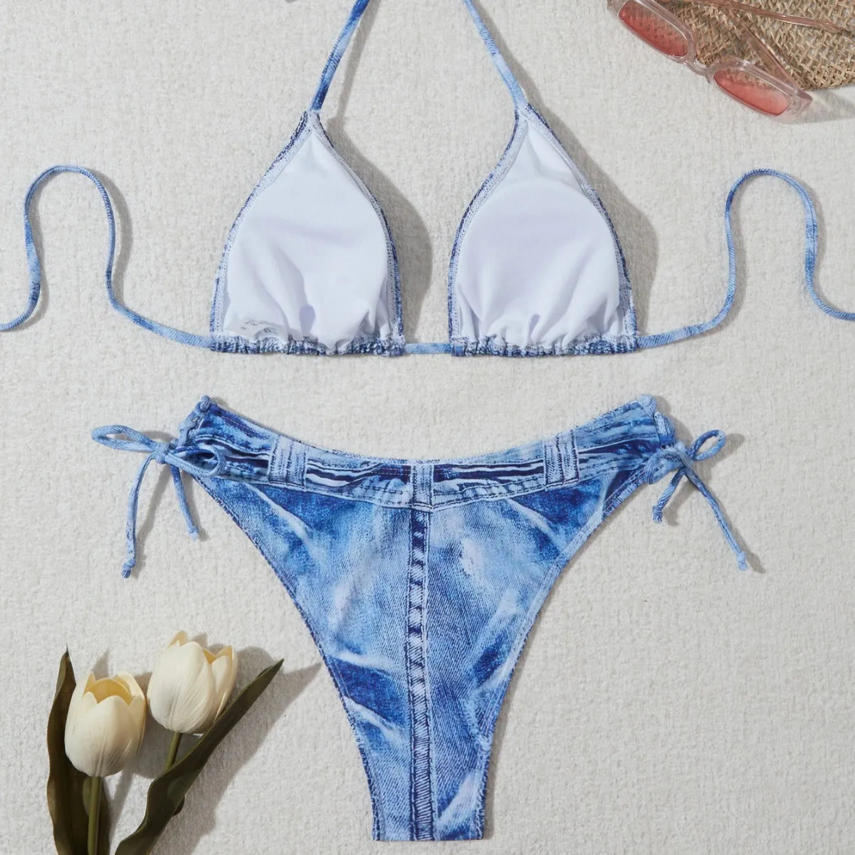 Women's denim blue printed strappy bikini set showing front view of two-piece swimwear