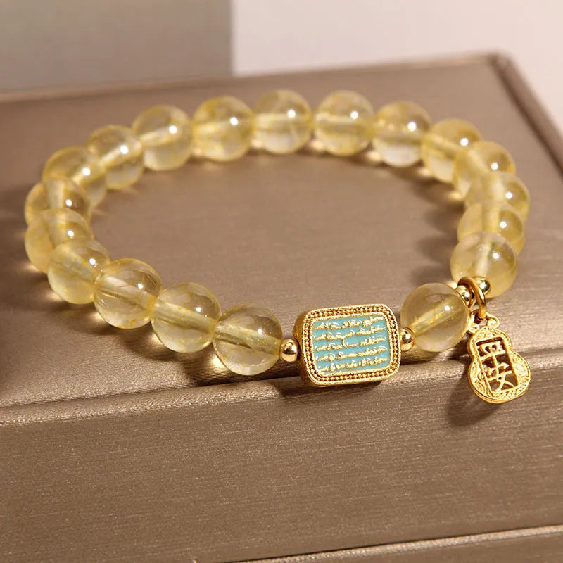 Women's natural yellow citrine crystal bracelet with decorative rhinestone elements