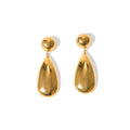 A pair of gold-coloured stainless steel earrings featuring geometric hemisphere shapes forming a water droplet design.