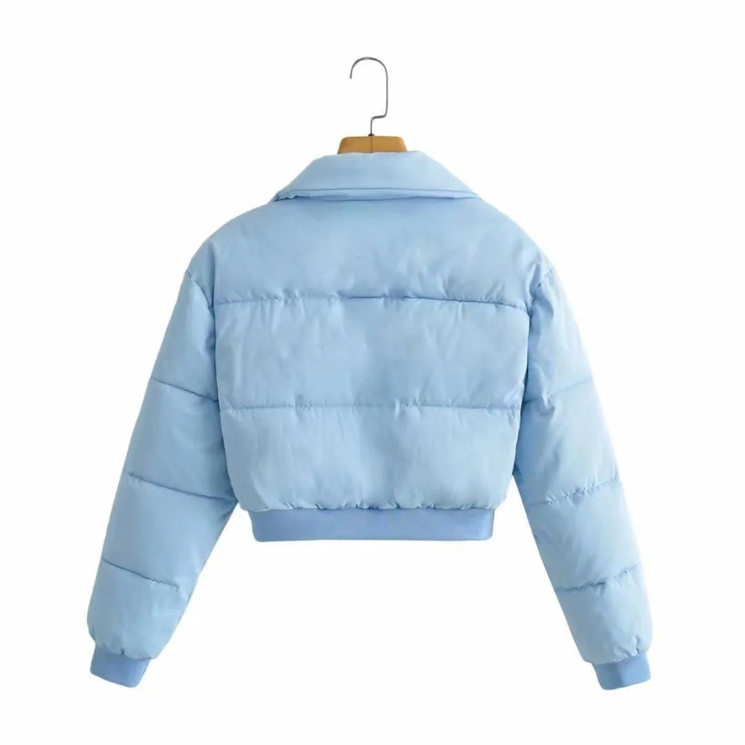 Women's loose blue polyester casual jacket with long sleeves on a hanger