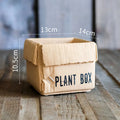 Cement flowerpot with paper carton aesthetic and drainage hole in Nordic style for indoor plants