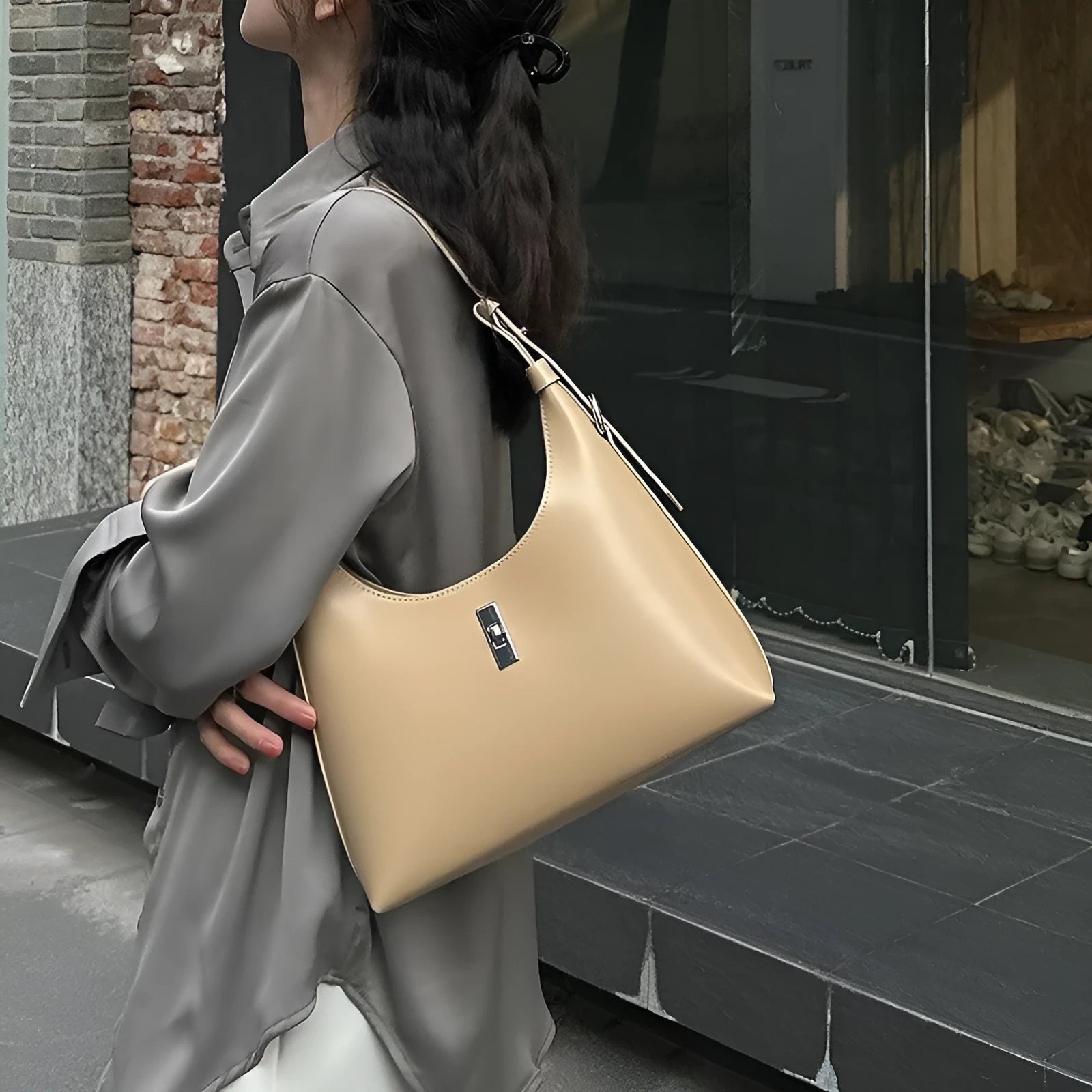 Soft genuine leather crossbody shoulder bag in a dumpling shape, shown in one of six available colours.