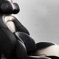 Car seat massage cushion and headrest set made from memory foam in a neutral colour.