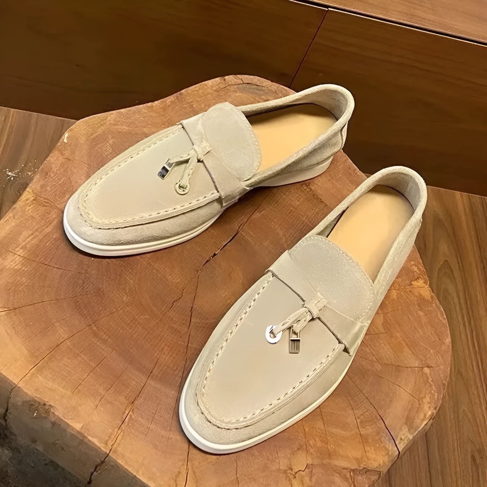 Gommino slip-on loafers with high-top design, round toe with steel head, and sewing line detail on artificial PU upper