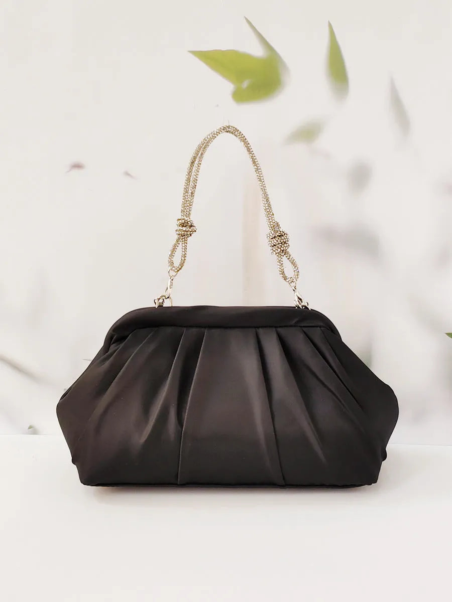 Women's soft polyester shoulder messenger bag in shell shape with diamond folds and chain detail.
