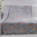 Children's cartoon flannel blanket covering an air conditioner in blue and red design