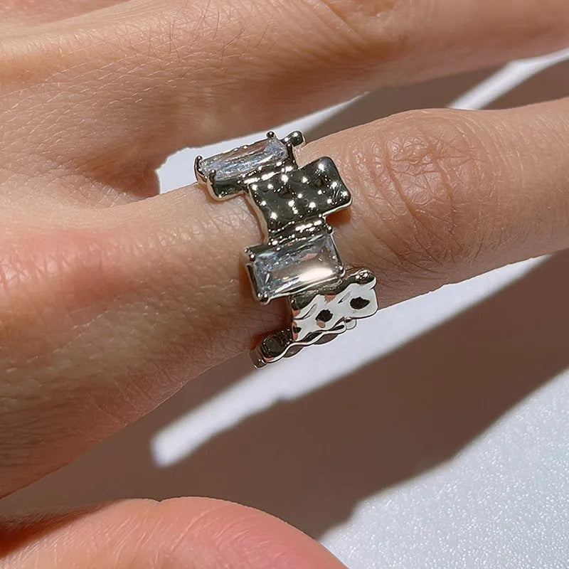 Silver open ring with cross zircon stones and geometric design