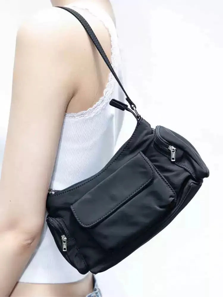 Black PU women's shoulder bag with side line detail, showing double pockets and measuring 24cm long.