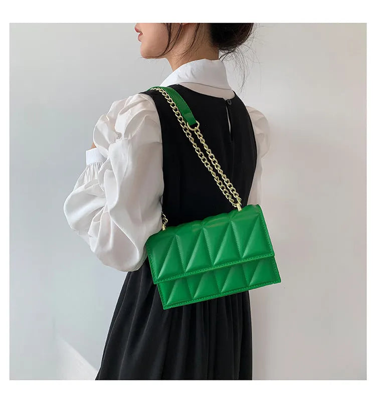 Small square PU chain crossbody bag in horizontal shape with spliced detail, available in five colours.