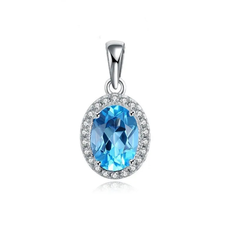 925 sterling silver jewellery set with blue topaz stones showing earrings, ring, pendant, and necklace with chain in geometric design