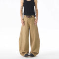 Brown loose-fit straight-leg men's jeans with a button fly and mid-rise waist.
