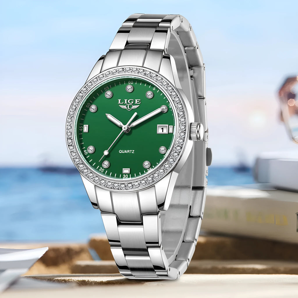Silver stainless steel women's quartz watch with luminous hands on a 34mm round dial.