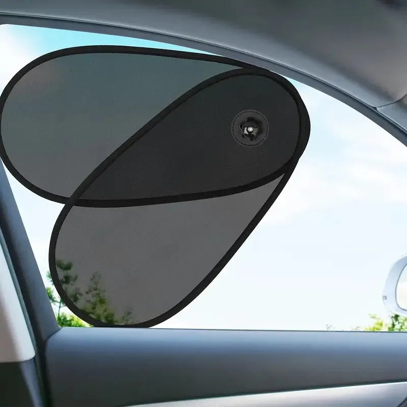 Black stretchy car side window sunshade with suction cups attached to protect a baby from sun.