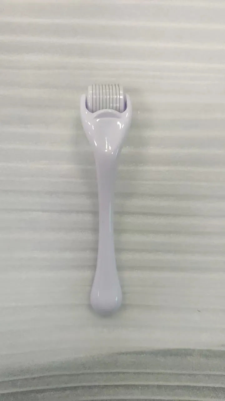 Black handle microneedle roller with purple wheel showing 540 needles, next to white and blue handle options.