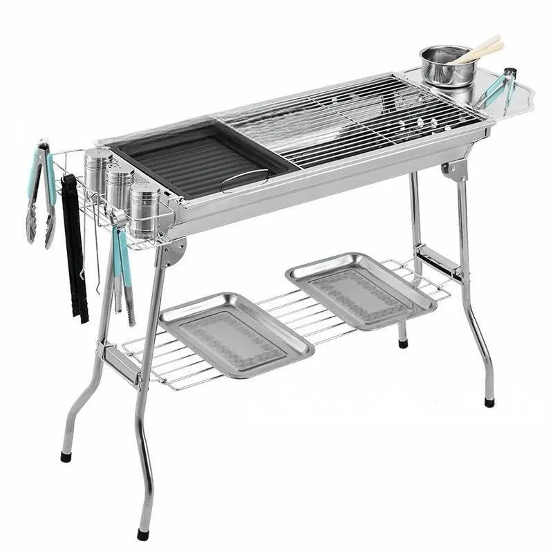 Stainless steel portable folding barbecue oven with grill, shown collapsed for storage