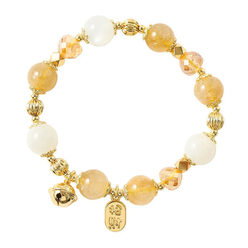 Gold electroplated bracelet with rutilated quartz and a ringing bell charm