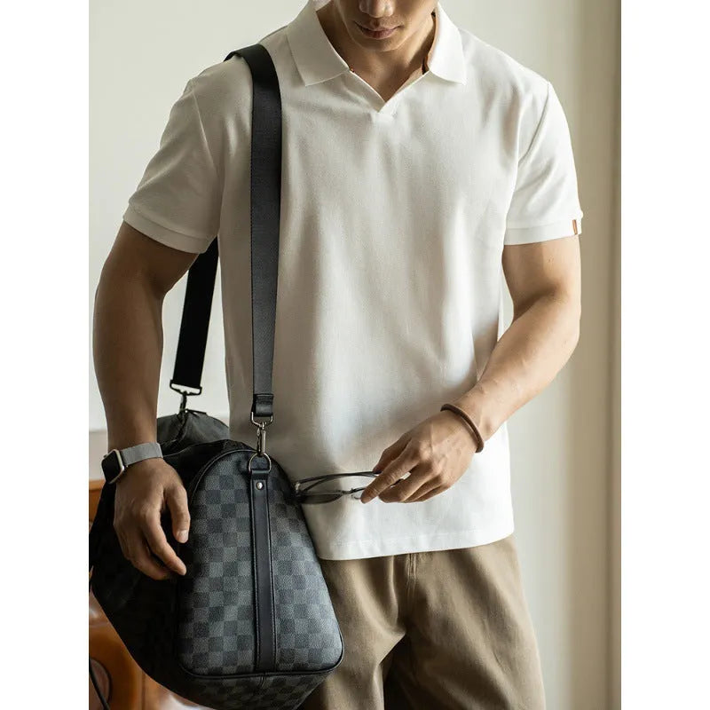 Men's blue short-sleeved cotton blend polo shirt on a hanger, showing regular fit and casual style.