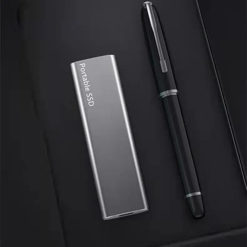 Ultra-thin metal external SSD hard drive shown in red, with high-capacity storage for laptops and computers.