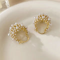 Gold colour women's floral basket design earrings with small beads and pearl inlay on copper