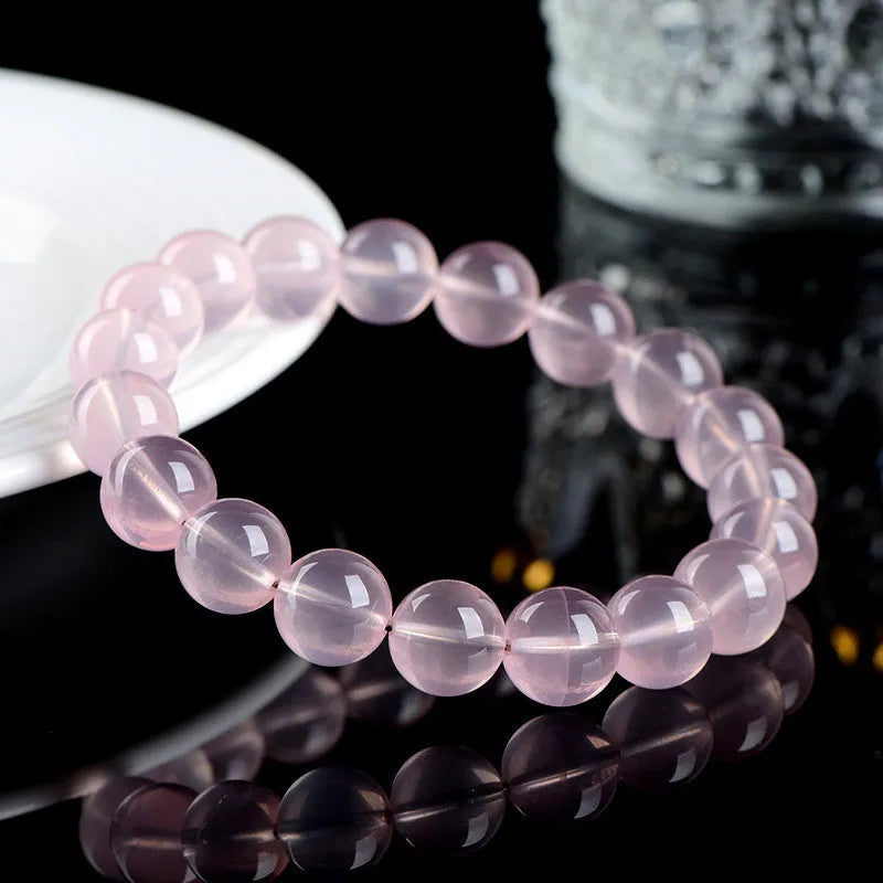 Natural crystal round bead women's bracelet with polished finish in pink colour grades
