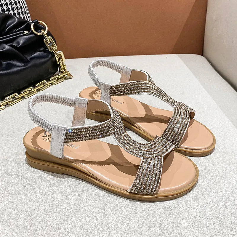 Women's patent leather beach sandals with rhinestone decoration on round toe in gold colour