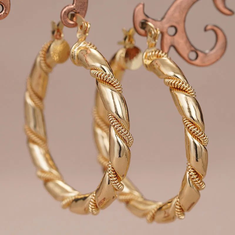 Geometric copper earrings in golden colours with ring and line elements for women