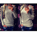 Women's white hollow-out crocheted knit shirt with round neck and long sleeves laid flat.