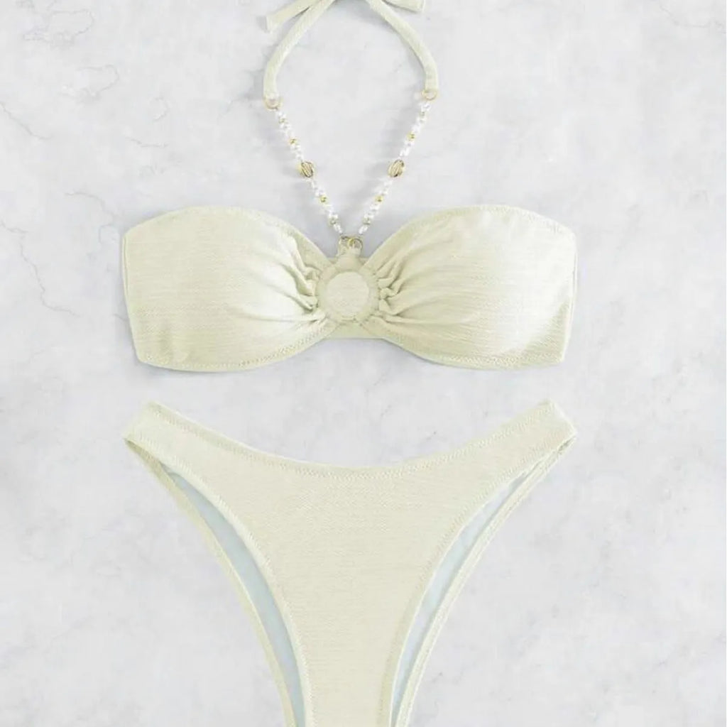 Women's solid colour halter bikini set in creamy-white, shown front-on.