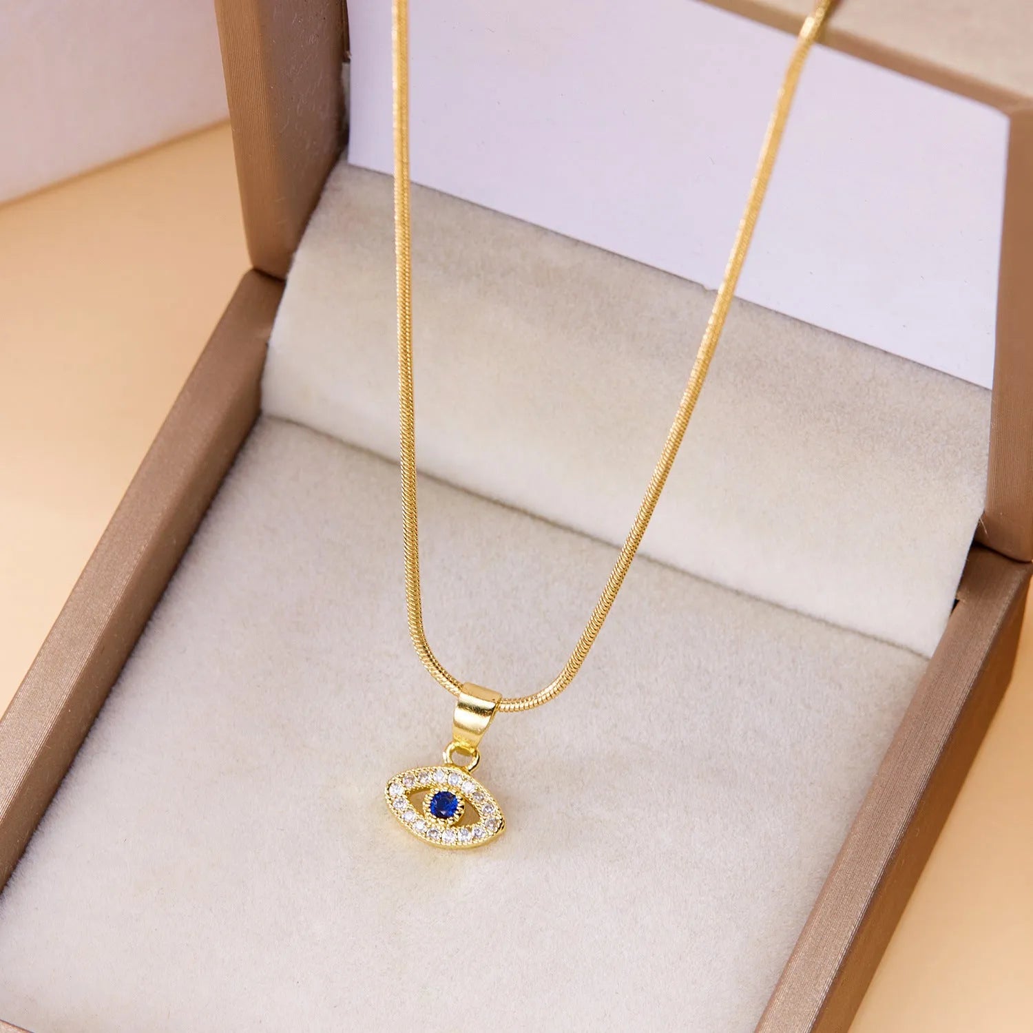 Blue eyes diamond devil's eye copper pendant necklace with electroplated finish on adjustable cross chain