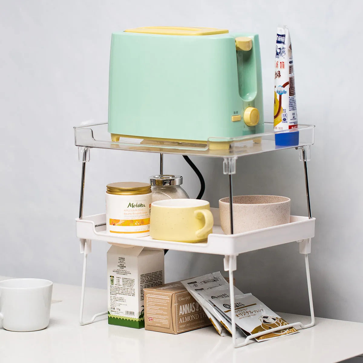 Plastic kitchen supplies rack for organising utensils on desktop or in cupboard storage
