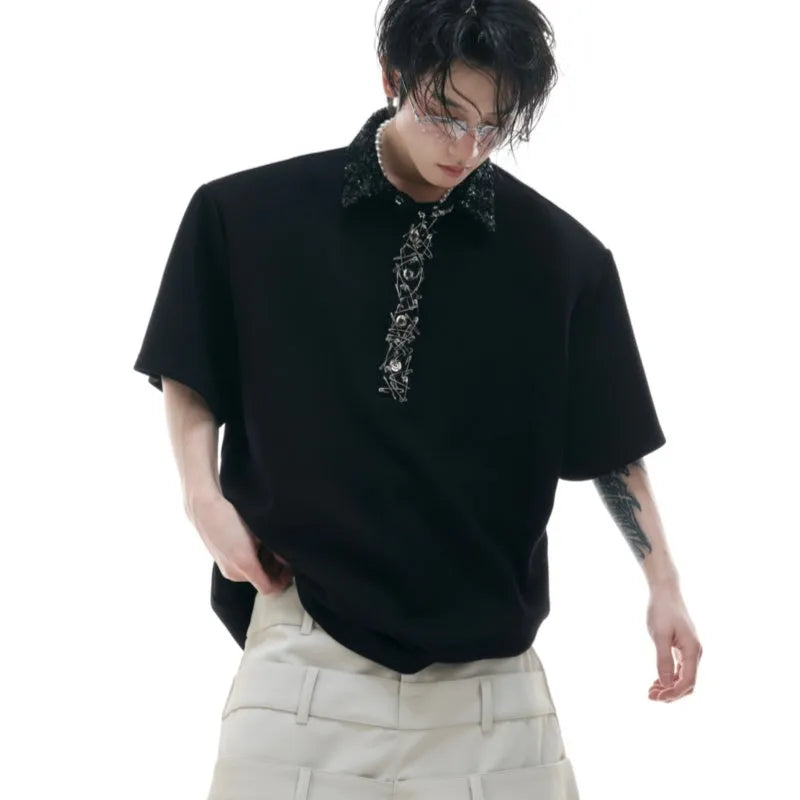 Black men's loose fit polo t-shirt with short sleeves and a square collar decorated with heavy embroidery sequins.