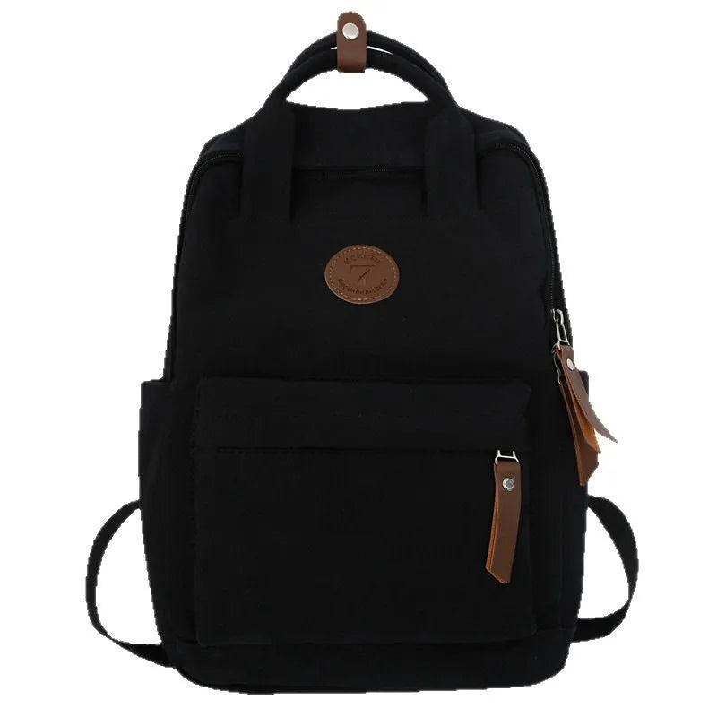 Black retro-style Oxford cloth backpack with curved shoulder straps.