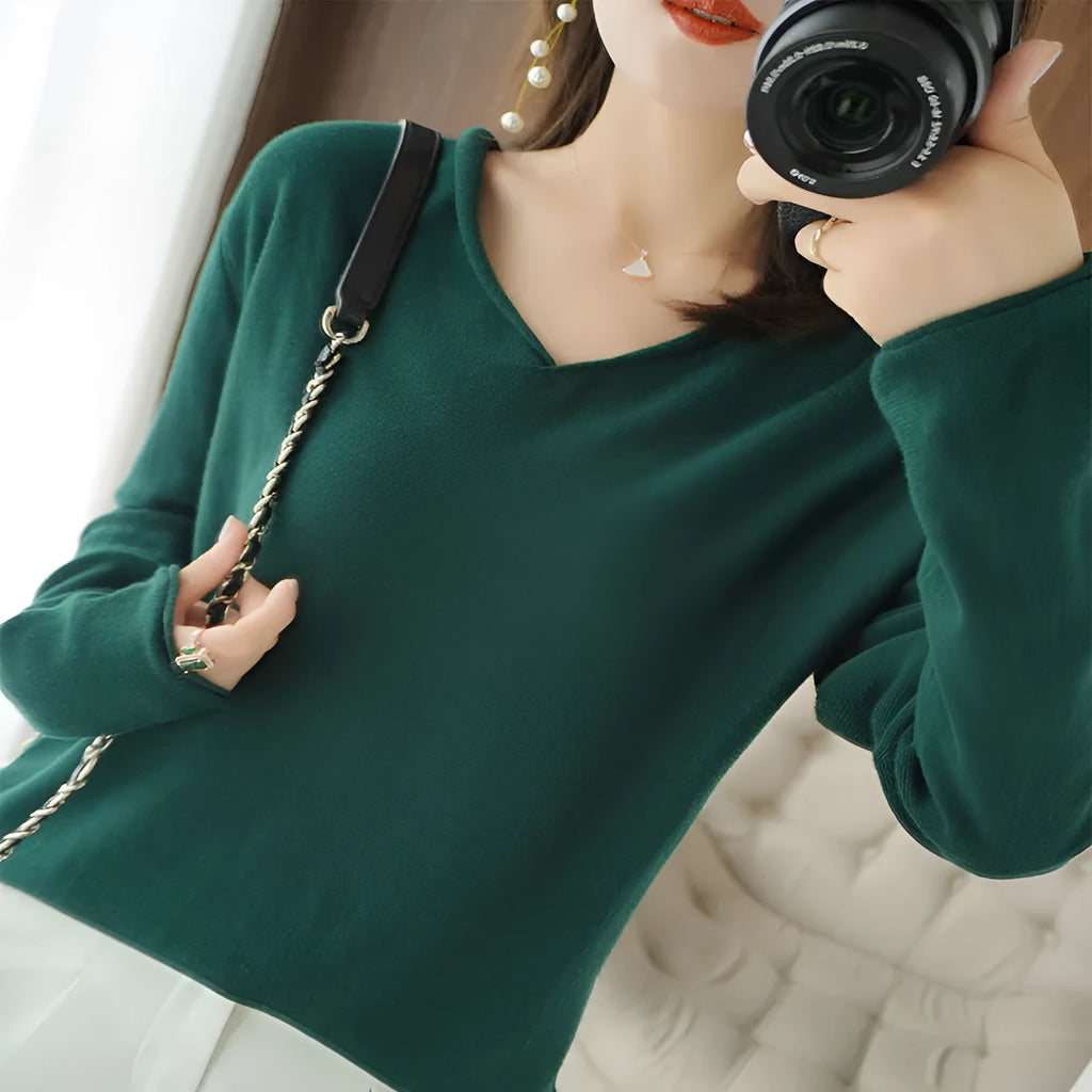Women's V-neck long sleeve knit pullover top in a macaron colour on a hanger.