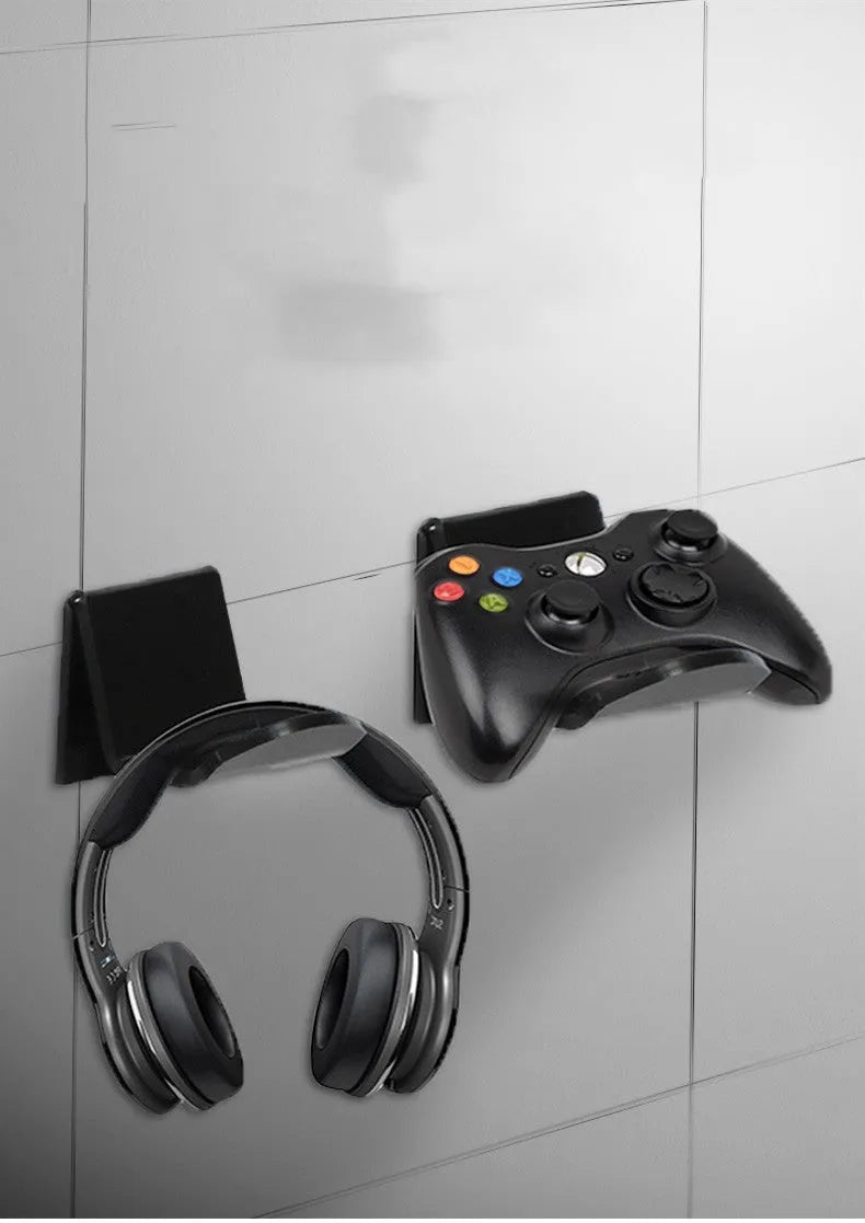 Universal plastic wall mount bracket holding a game controller, shown in black, white, and transparent colour options.