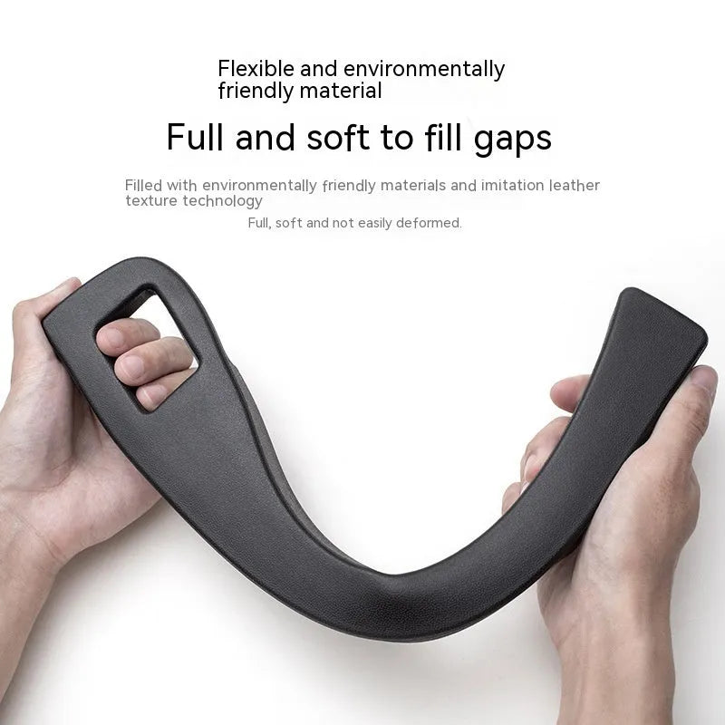 Black car gap storage box with handle placed between vehicle front seats