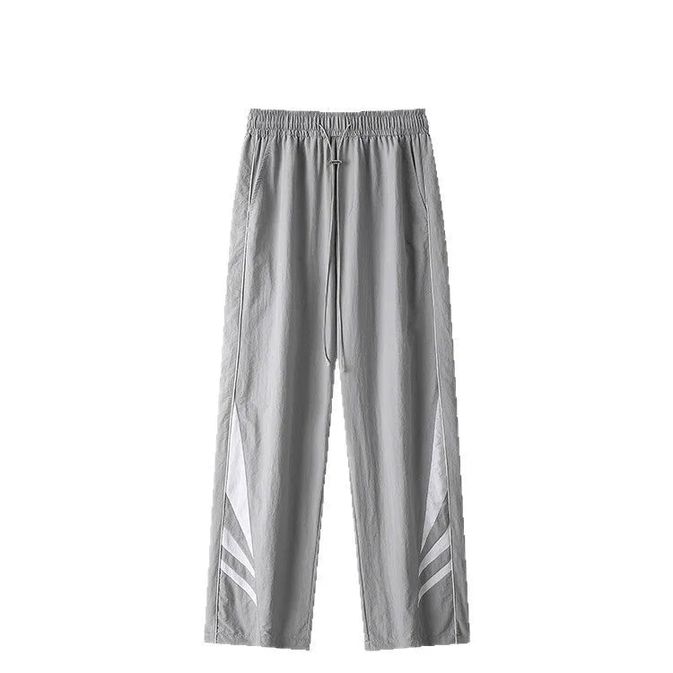 Men's black loose-fit straight-leg sports trousers for summer, shown on a hanger.