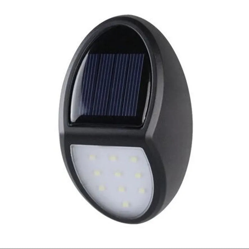 Black rectangular solar wall light with solar panel and LED illumination