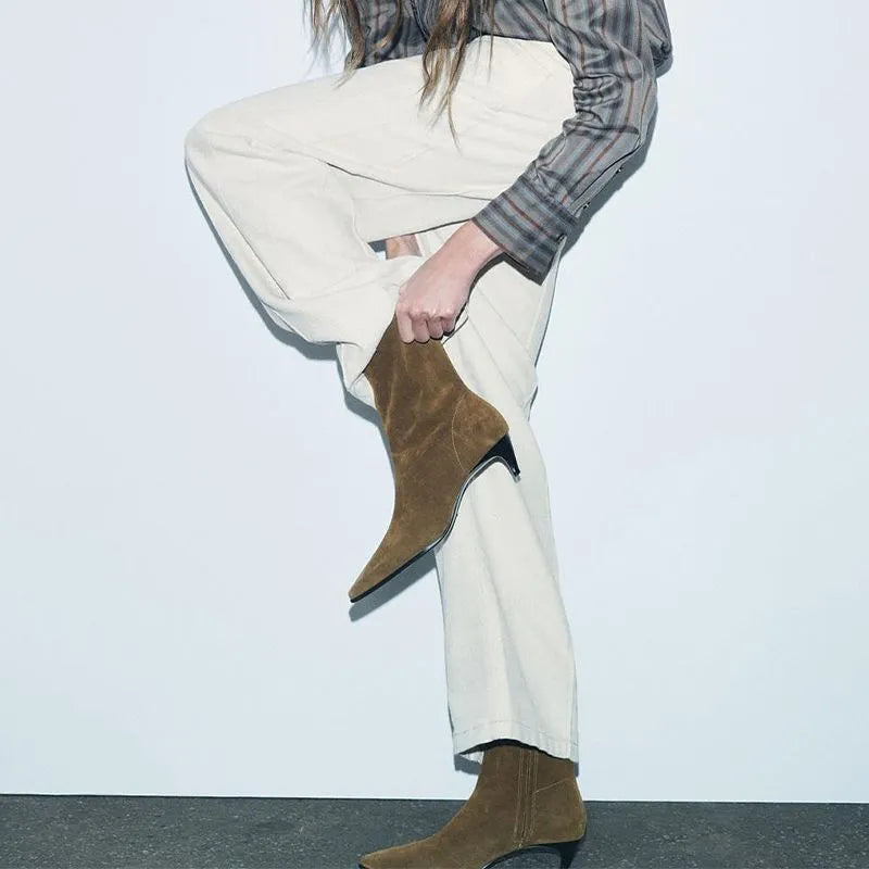 Brown women's square toe ankle boots with a side zip and a stiletto kitten heel on a waterproof platform sole.