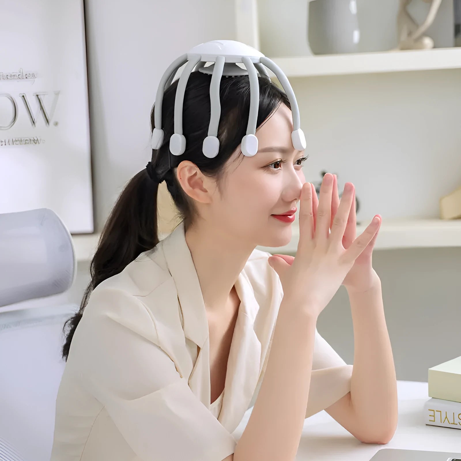 Black USB-powered electric head massager with multiple vibrating claws on scalp