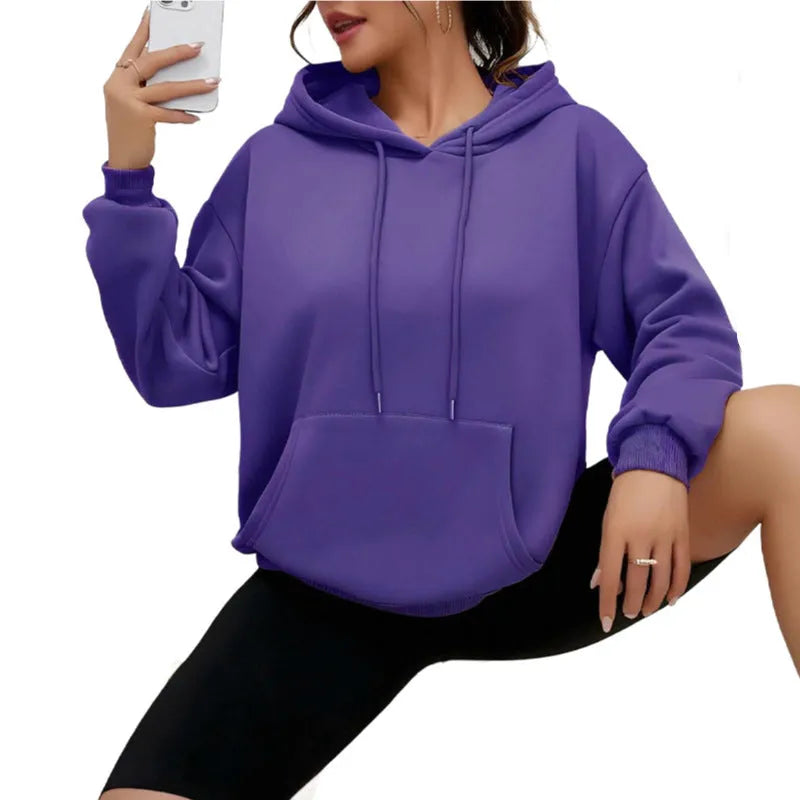 Women's loose grey drawstring pocket sweatshirt with long sleeves and a front pouch.