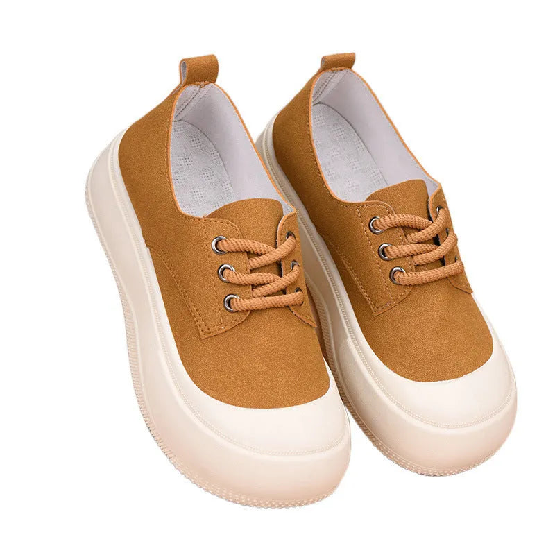 Women's beige suede platform loafers with round toe and front lace-up, on a white background.