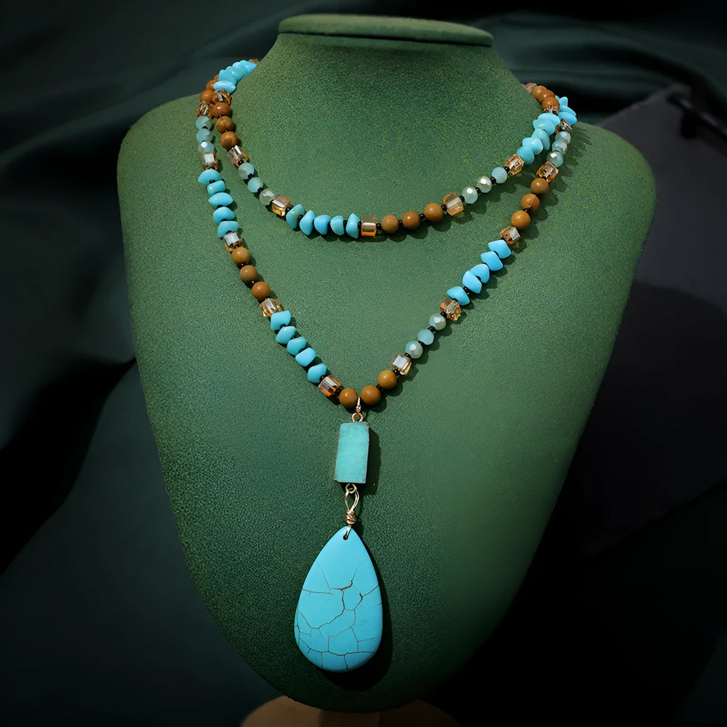 Turquoise blue water drop shaped pendant necklace with ball bead chain and geometric design elements