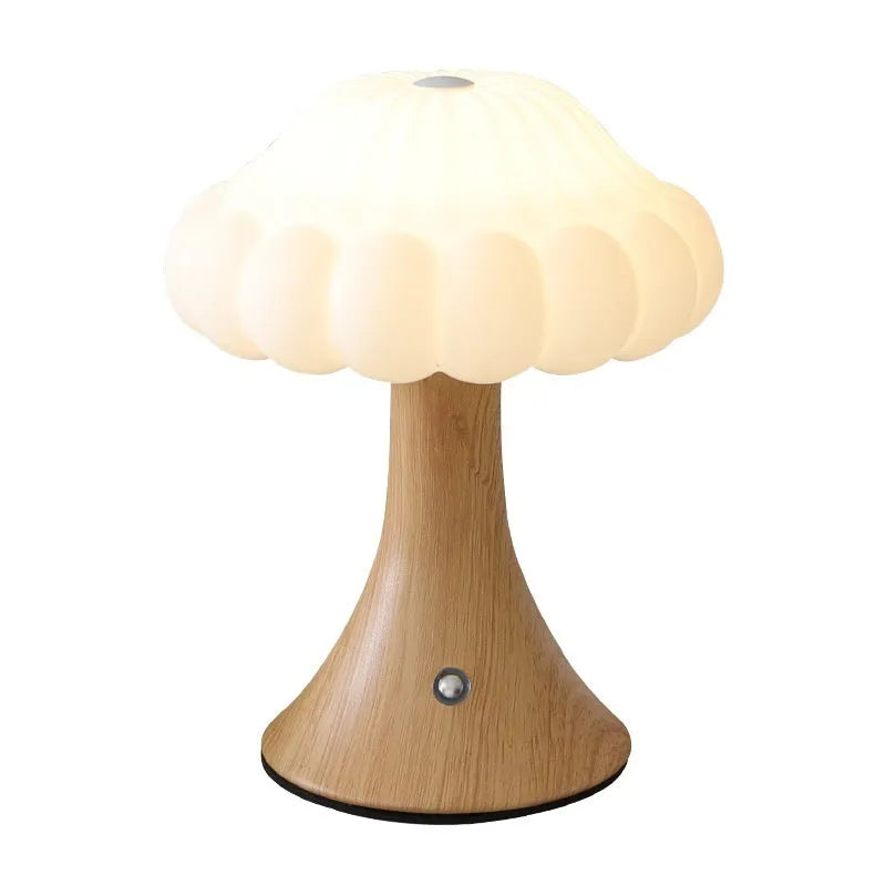 Wood grain coloured mushroom-shaped touch lamp with USB charging port on a table