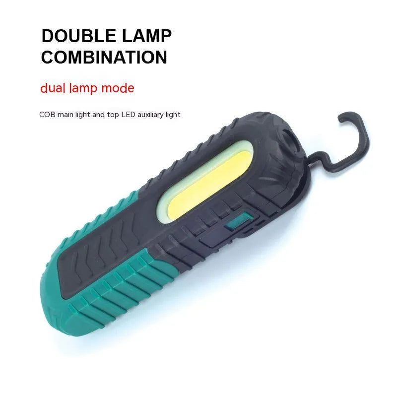 Black and green auto repair work light with PET coating for drop resistance