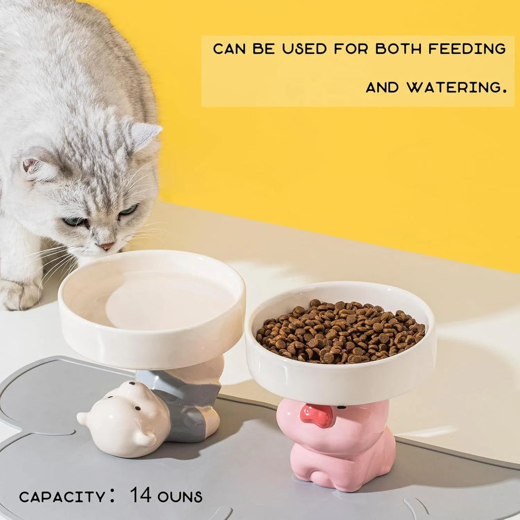 Ceramic elevated cat food bowl with animal theme design in pink, yellow, or white